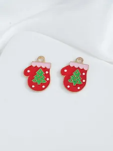 Detail showing gold-plated red enamel Christmas glove charms with tiny green tree motifs