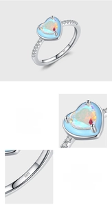 Macro shot of S925 sterling silver ring with heart-shaped rainbow zircon and blue enamel edge