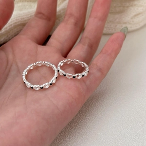 Minimalist 925 sterling silver open ring with hollow heart patterns and black accents