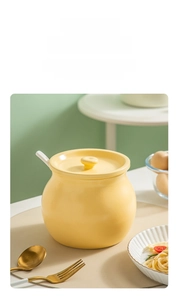 Large capacity warm yellow ceramic lard jar with lid and matching long handle spoon