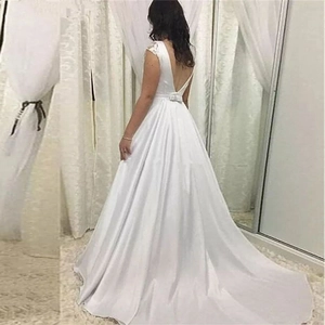 Elegant white satin wedding dress with deep V backless design and grand long train