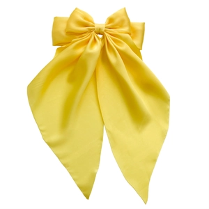 Large yellow satin bow hair clip with elegant long ribbon streamers for women accessories