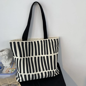 Minimalist black and white striped canvas tote bag with long handles for women
