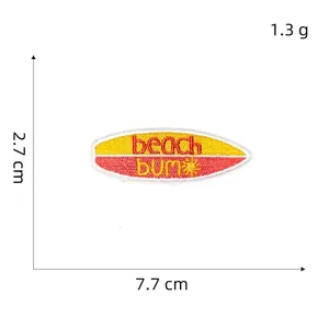 Detailed macro view showing the beach bum surfboard embroidery patch with dimensions