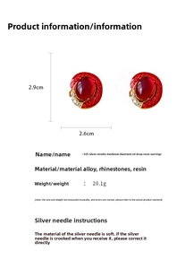 Detail view of vintage red resin earrings showing dimensions 2.9cm x 2.6cm and materials