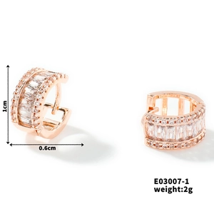 Detail shot of rose gold hoop earrings with cubic zirconia inlay and size measurements
