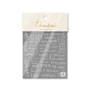 Detail of thin flexible nail art stickers with white hand-drawn letters on clear background