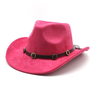 Detail of rose red western cowboy hat featuring suede texture and decorative leather band