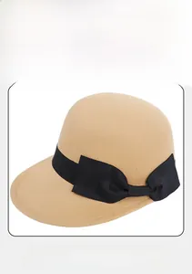 Detail view of the elegant black bow on this vintage camel wool fedora hat