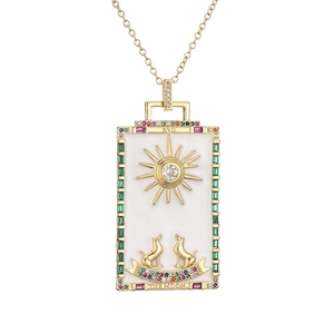 Golden tarot necklace with The Moon pendant featuring white enamel and colorful gemstones