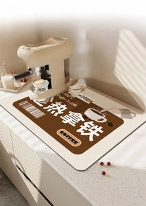 Detailed heat-resistant coffee bar mat with Coffee Latte graphics on kitchen counter