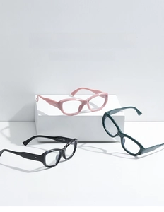 Detailed view of cat eye anti-blue light glasses frames in black, pink and green