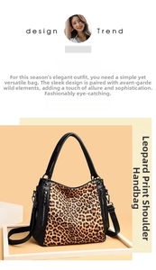 Detail view of large leopard print tote with black leather straps and metal zippers
