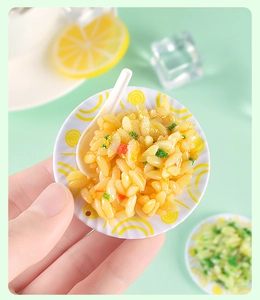 Macro shot of miniature fried rice plate with spoon for dollhouse kitchen accessories