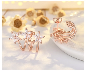 Macro shot of rose gold flower earrings with white marquise cubic zirconia petals