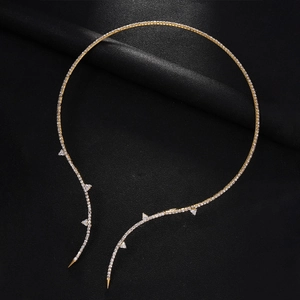 Sparkling rhinestone open collar necklace in gold finish with triangle accents