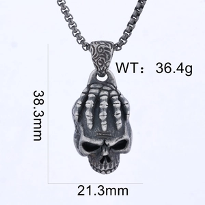Detail view of vintage skull pendant showing dimensions 38.3mm height and 36.4g weight
