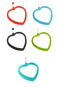 Detailed view of heart-shaped silicone egg rings in five assorted vibrant colors