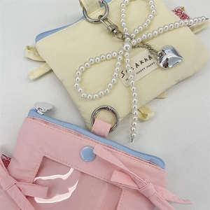 Bow card holder with pearl chain and heart pendant in yellow and pink pastel colors