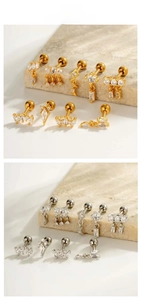 Macro detail of teardrop zircon screw back earrings in gold and silver finish