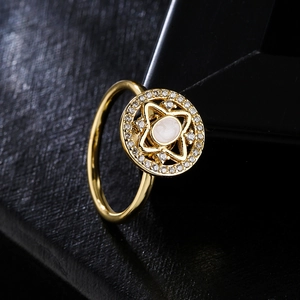 Rotating geometric ring in 18K gold plating with sparkling cubic zirconia and cat-eye stone