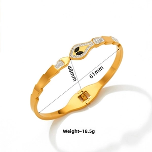 Detail of gold snake bangle with zircon scales, spring closure and 61mm inner diameter