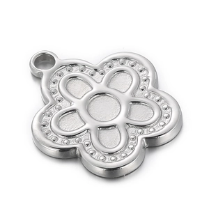 Polished silver stainless steel flower pendant charm with textured beaded edge petals