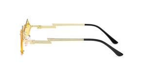 Detailed side view of trendy sunglasses with gold lightning bolt temples and orange lenses