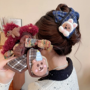 Detailed view of plush animal hair claws with cute cartoon bear and rabbit designs