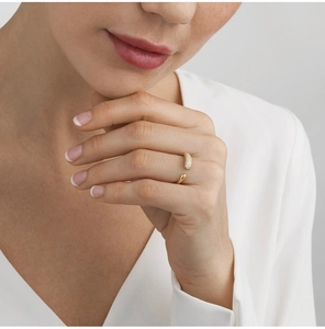 Macro detail of 18k gold plated stainless steel teardrop ring with pave zircons