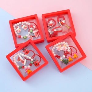 Kids Christmas hair accessory gift set with elk and snowflake charms in red display boxes
