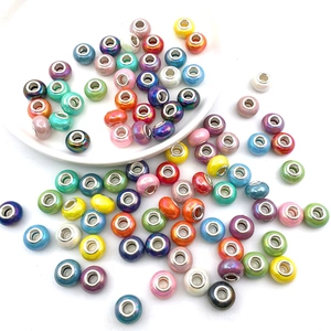 Close-up of vibrant large-hole glass beads with metal cores for DIY charm bracelets