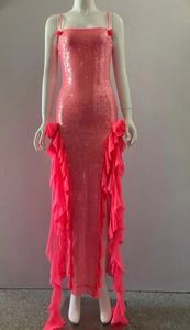 Detailed view of pink sequin evening gown with ruffled chiffon flowers and slim straps