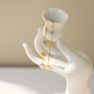 Two-tone silver and gold long tassel drop earrings with circular sequins and chic hooks