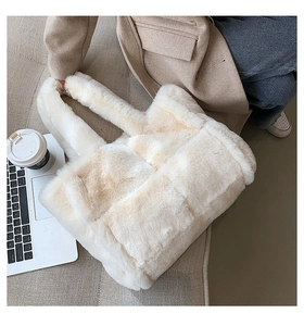 Chic cream faux fur tote bag in a cozy workspace setting with a soft plush texture