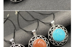 Detail of hexagram crystal necklaces in turquoise and aventurine on a black background