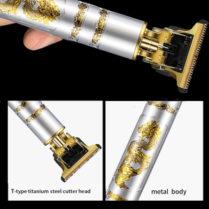 Detailed views of silver hair clipper with gold dragon carving and T-blade head