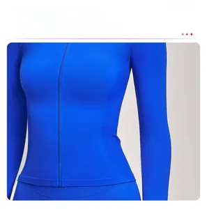 Detailed close-up of blue yoga jacket featuring ribbed waist design and front zipper closure