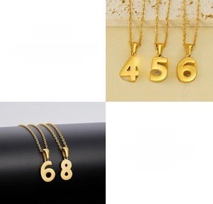 Macro detail of 18K gold-plated stainless steel numbers 4 5 6 8 with mirror polish finish