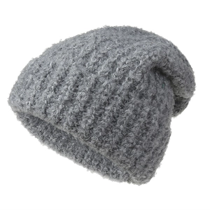 Thick dark gray knit beanie for women made of warm fuzzy yarn for cold winter days