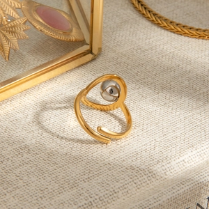 Two-tone stainless steel open ring with silver bead accent on gold adjustable band