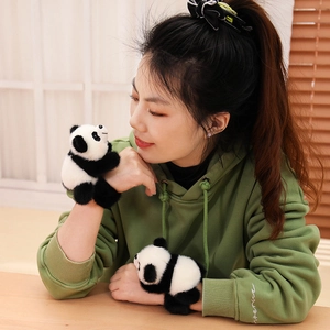 Cute panda plush wristband toy made of soft black and white fur for kids and gifts