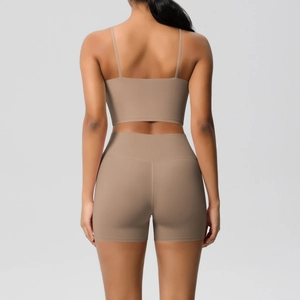 Back view of a ribbed yoga set with a strapless top and high-waisted shorts in taupe gray