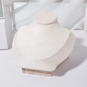 Macro detail of high-end bust jewelry stand with linen fabric and solid wood base