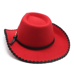 Classic red wool felt western cowboy hat with black braided trim and leather belt detail