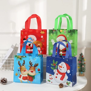 Detailed view of four colorful non-woven Christmas gift bags with festive handles