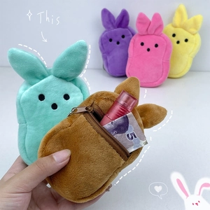 Macro view of plush Easter bunny coin pouches with zipper closure in various colors