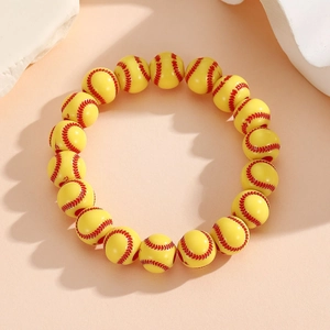 Detailed view of handmade softball sports bracelet with yellow beads and red stitch patterns