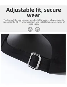 Close-up of adjustable silver metal buckle and black canvas strap on baseball cap back