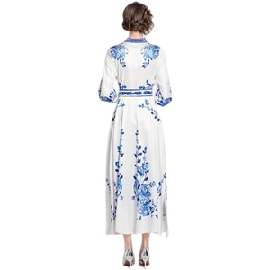Blue and white porcelain print maxi dress with long sleeves and elegant waist belt